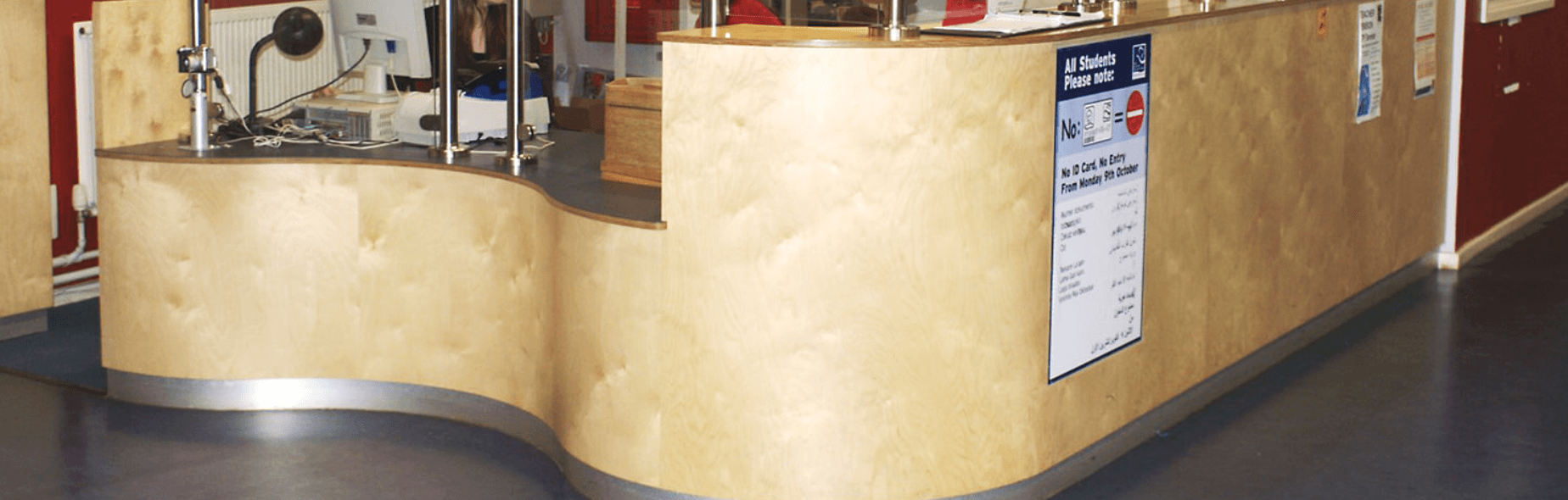Bespoke curved timber reception desk made for a commercial interior