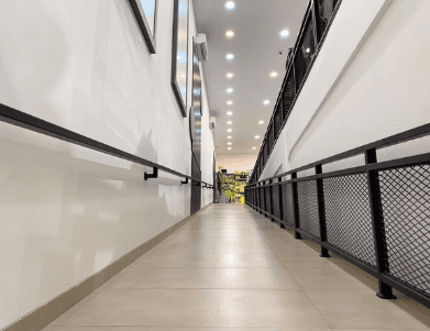 Commercial tiled floor surrounding a glazed retail unit